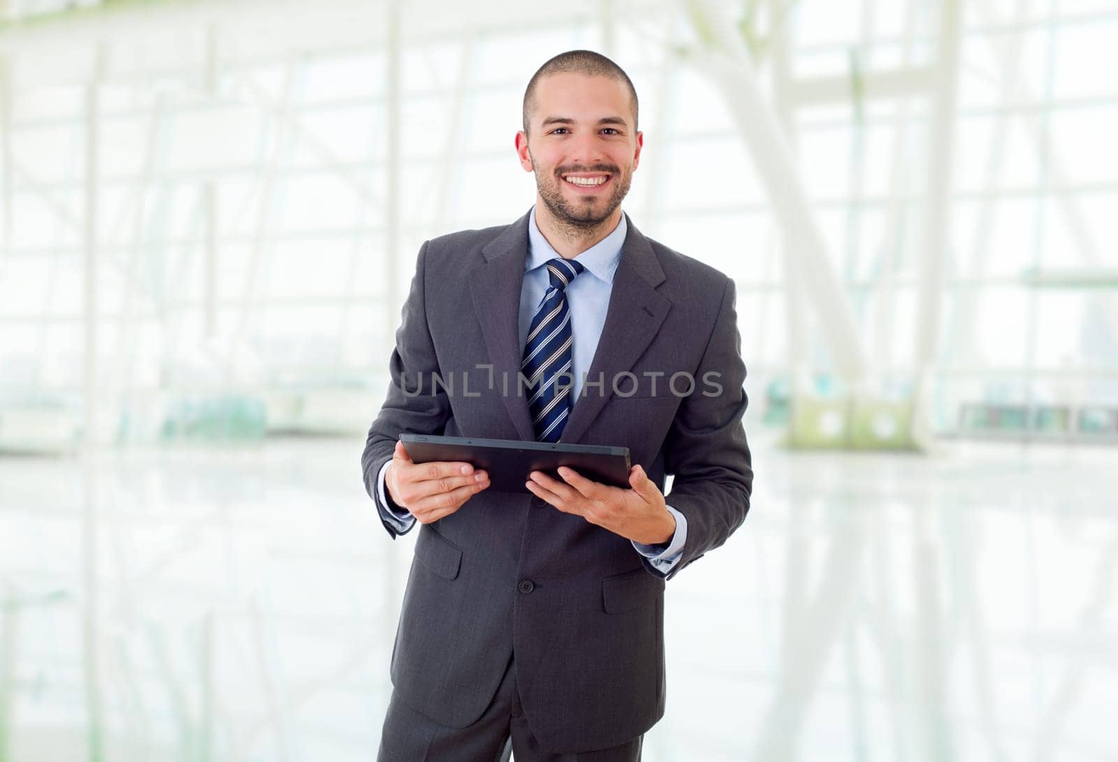 young businessman with a tablet pc, at the office