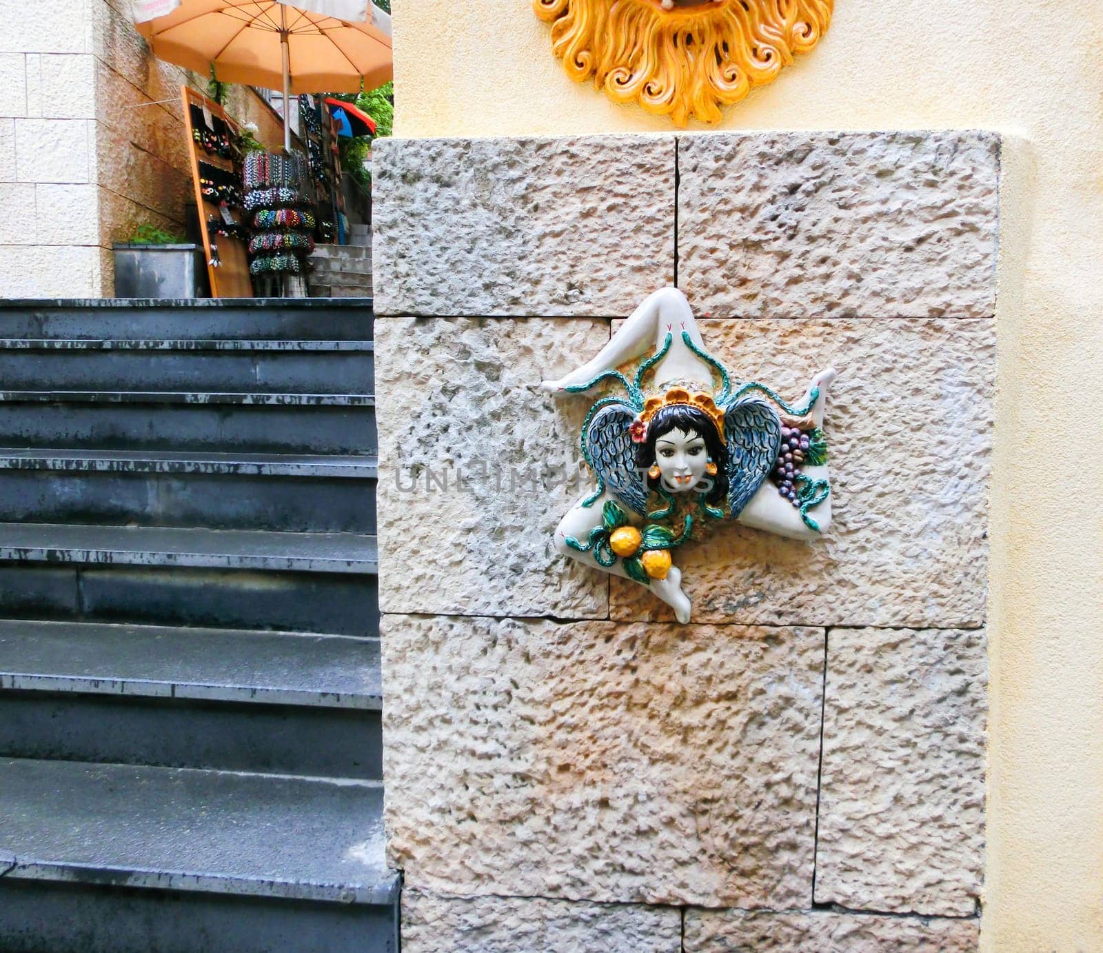 Triskelion - motif used in the flag of Taormina, found on one of the walls, Sicily island, Italy