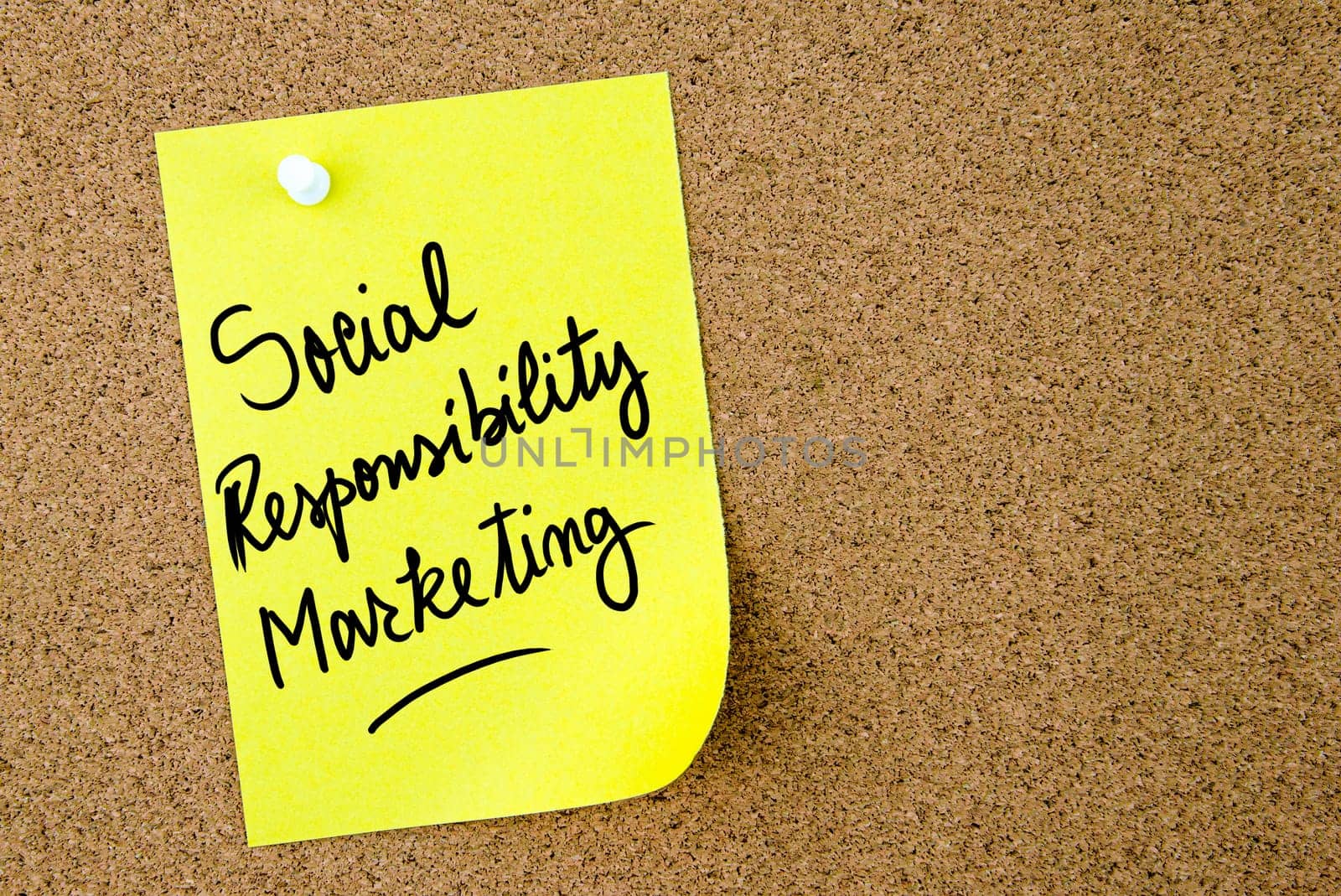 Social Responsibility Marketing text written on yellow paper note pinned on cork board with white thumbtack. Business concept image with copy space available