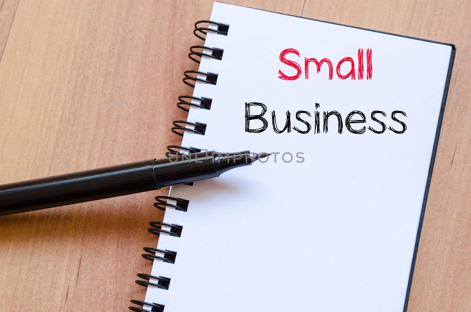 Small business text concept write on notebook