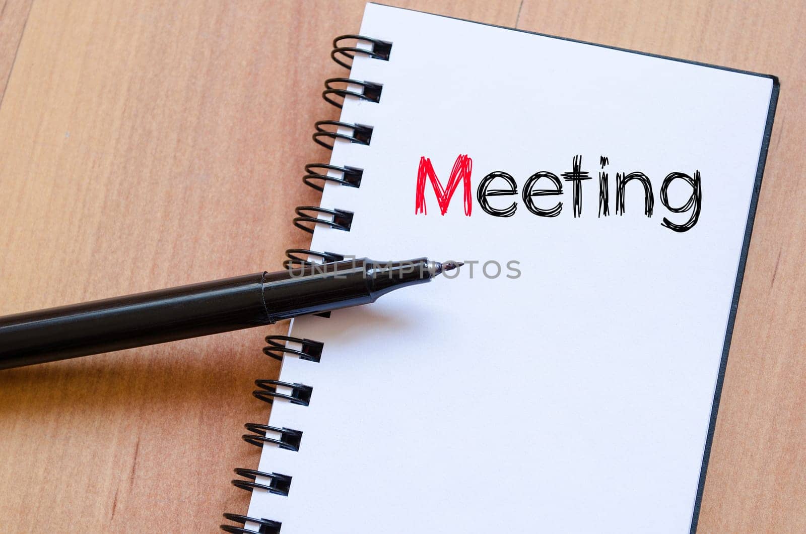 Meeting text concept write on notebook