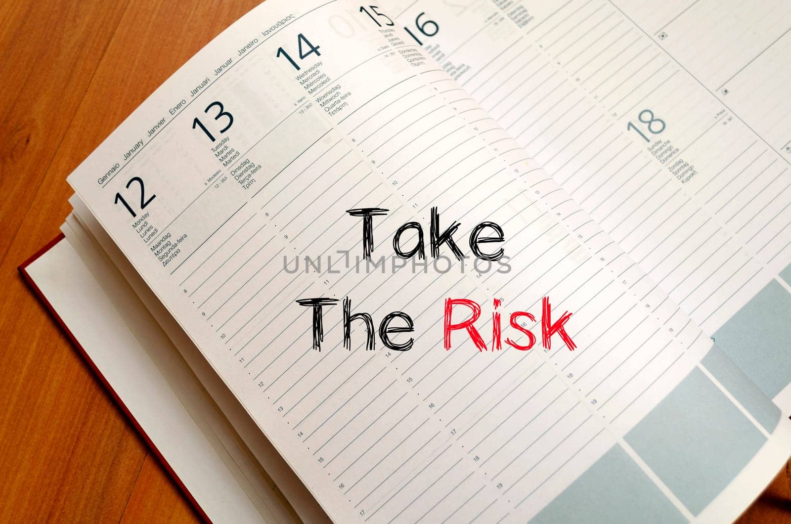 Take the risk text concept write on notebook