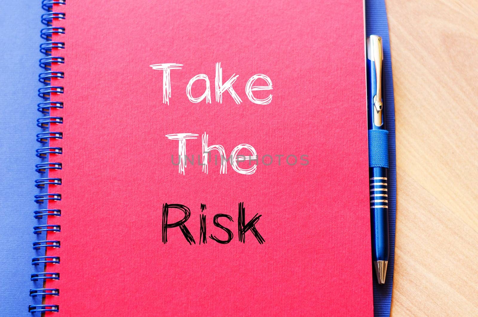 Take the risk text concept write on notebook