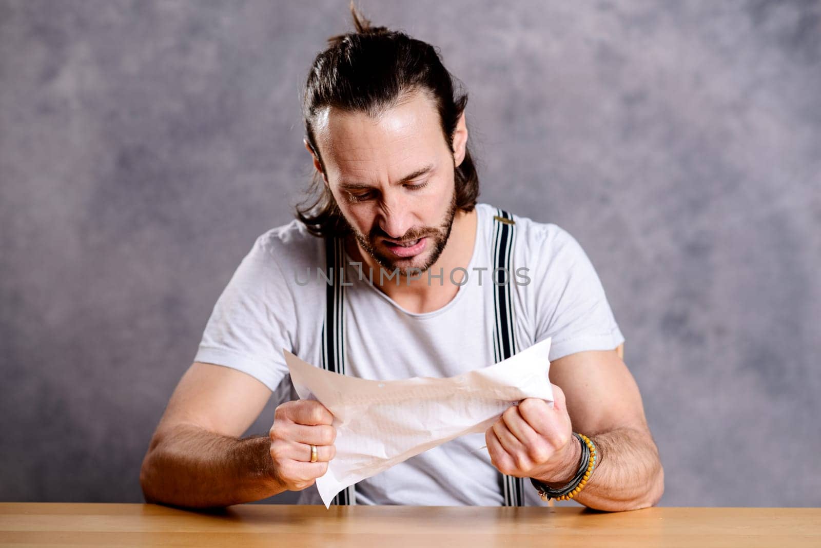 young man is annoyed about a letter