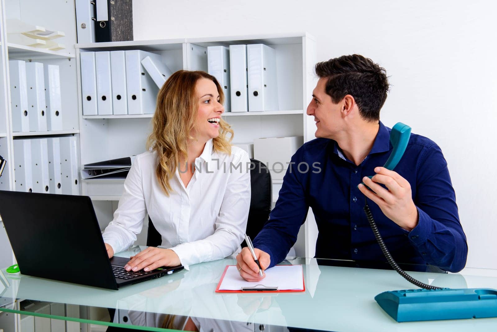 young businessman and businesswoman working together in the office