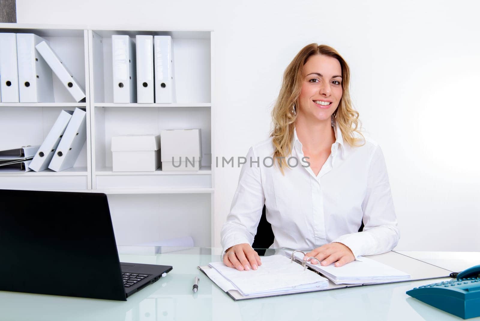 young blond businesswoman working in the office