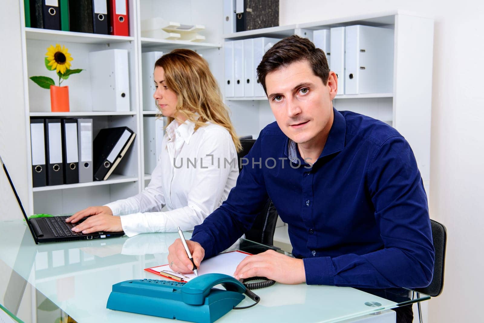 young businessman and businesswoman working together in the office