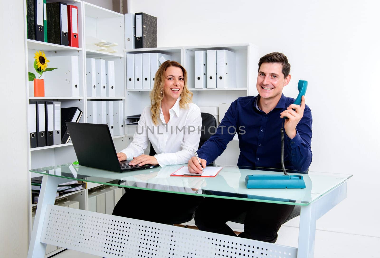 young businessman and businesswoman working together in the office