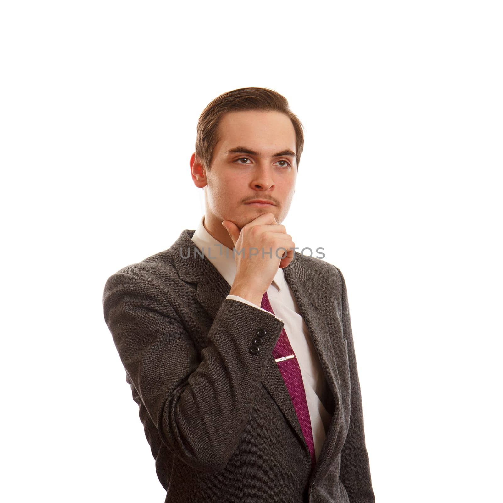 A man thinking while in a suit on white background