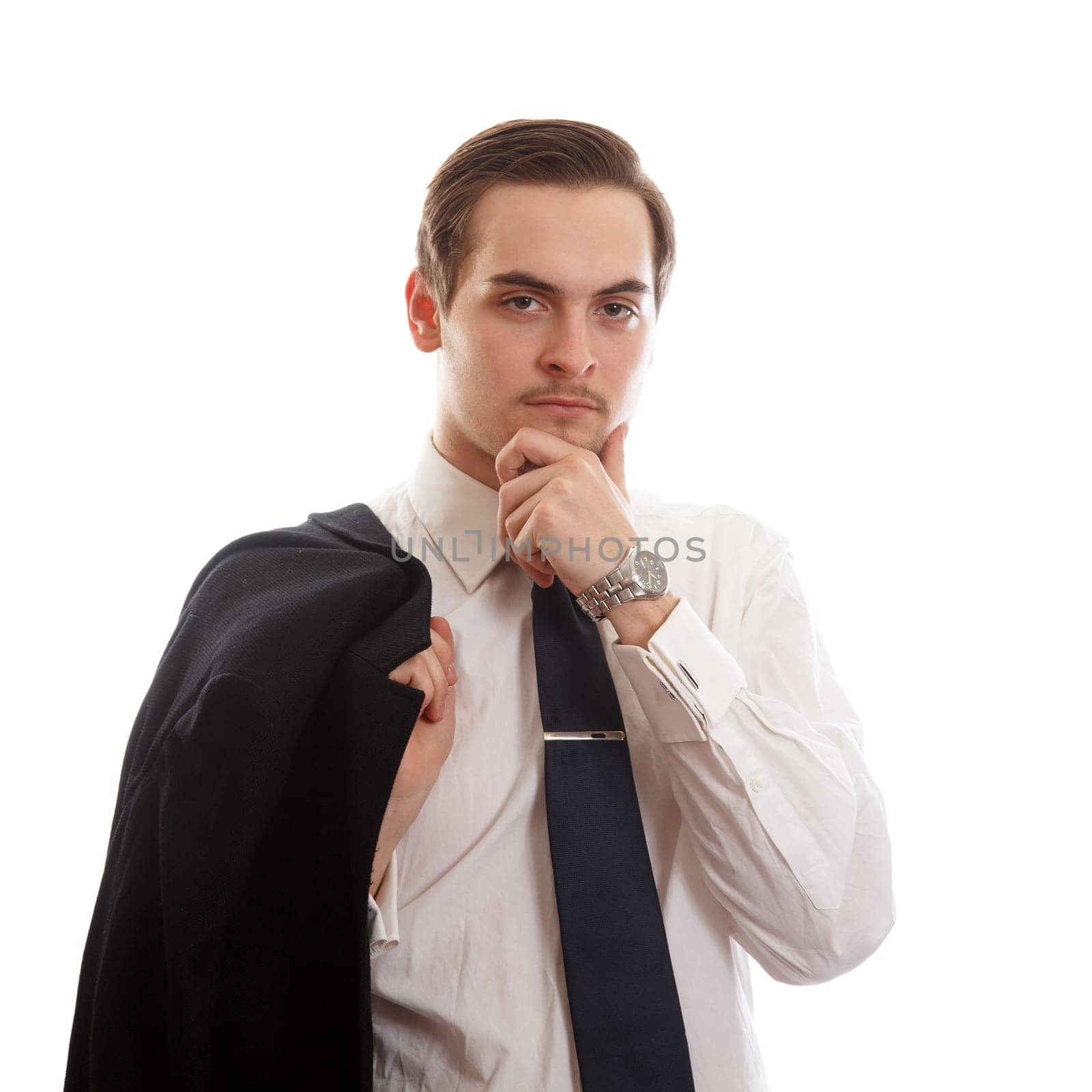 Man in a white shirt and a tie holding his jacket