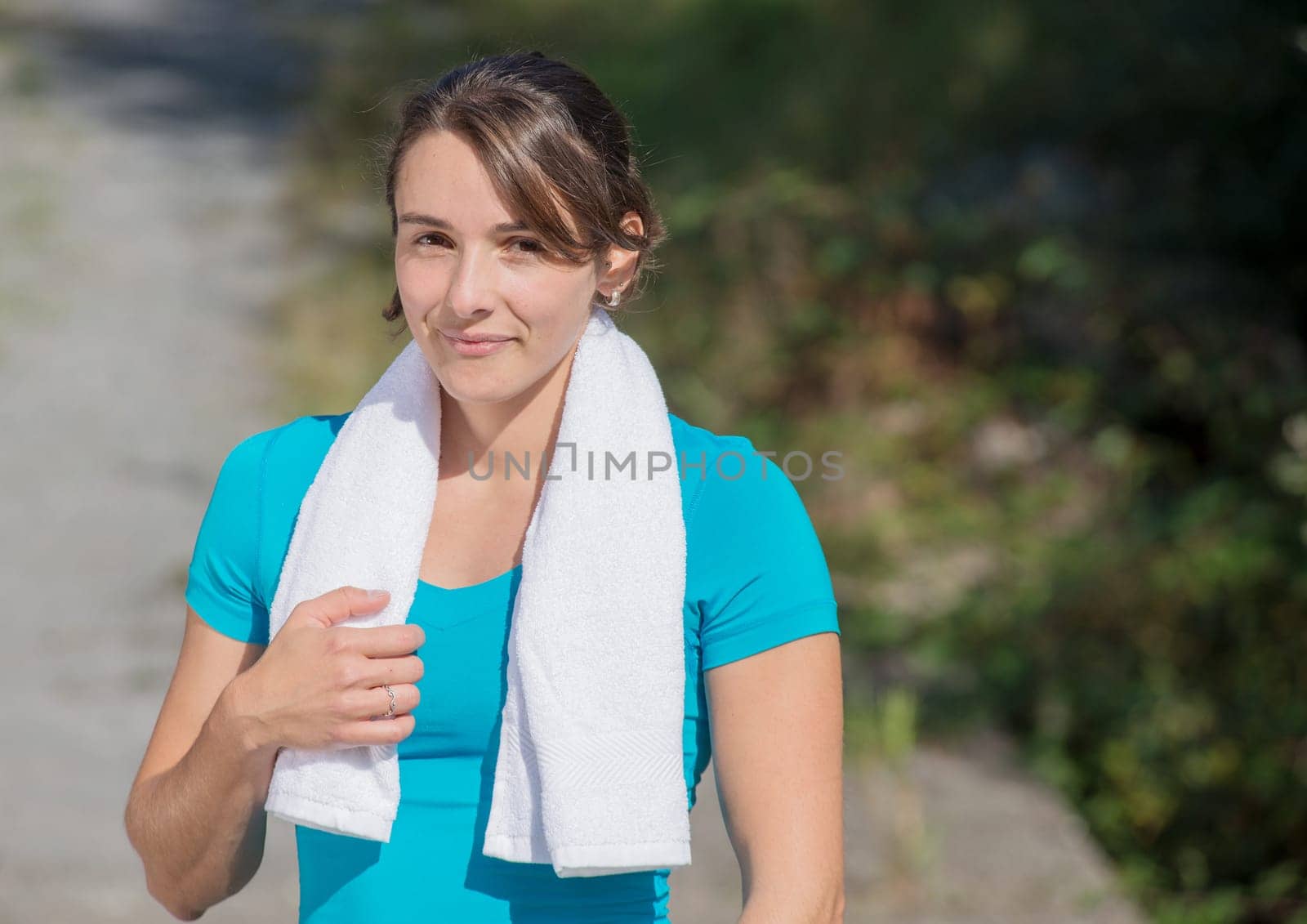 beautiful sporty young  woman relaxing after exercising