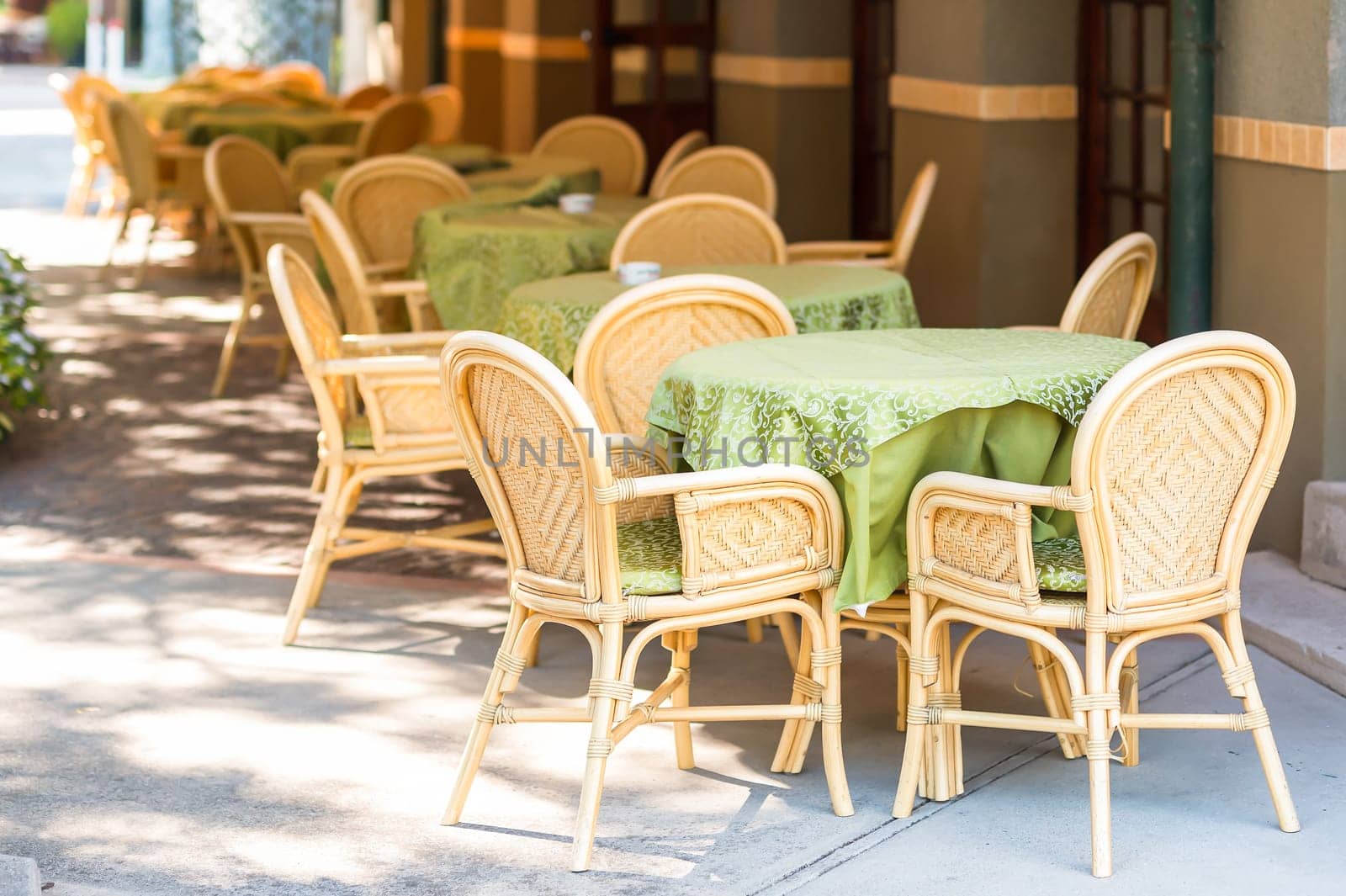 View of empty outdoor table of restaurant .