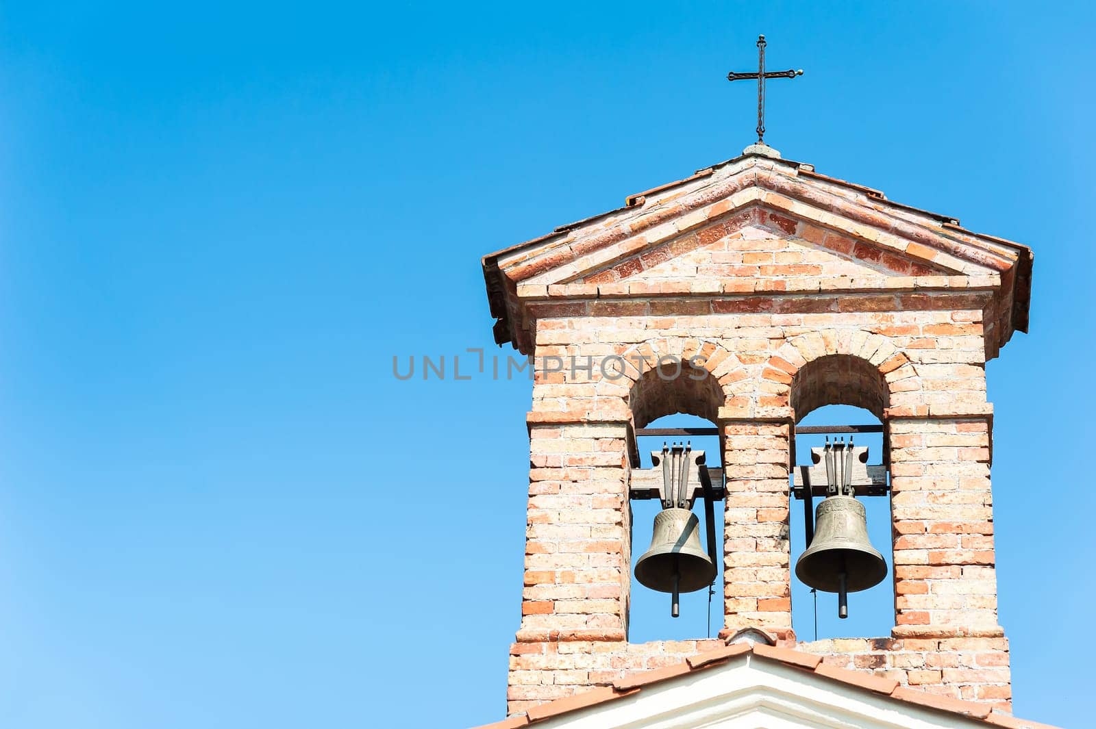 Small bell tower with a bell of a country church in the 14th century