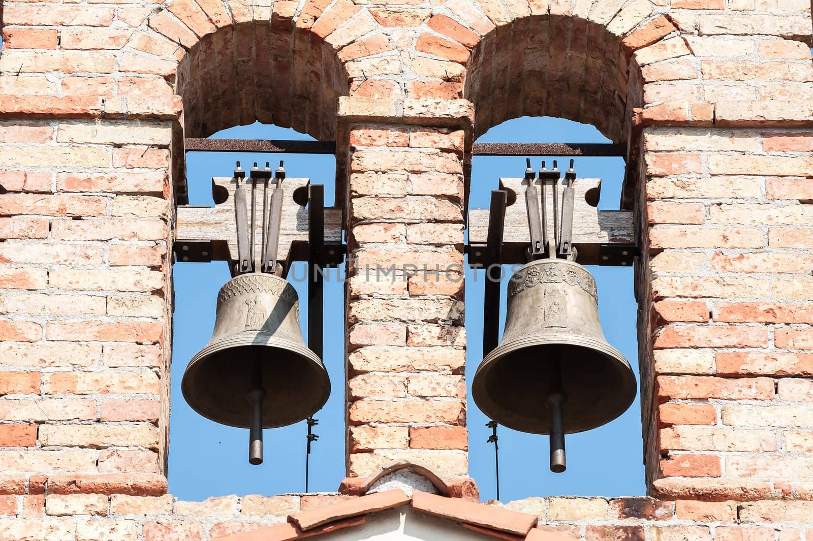Small bell tower with a bell of a country church in the 14th century