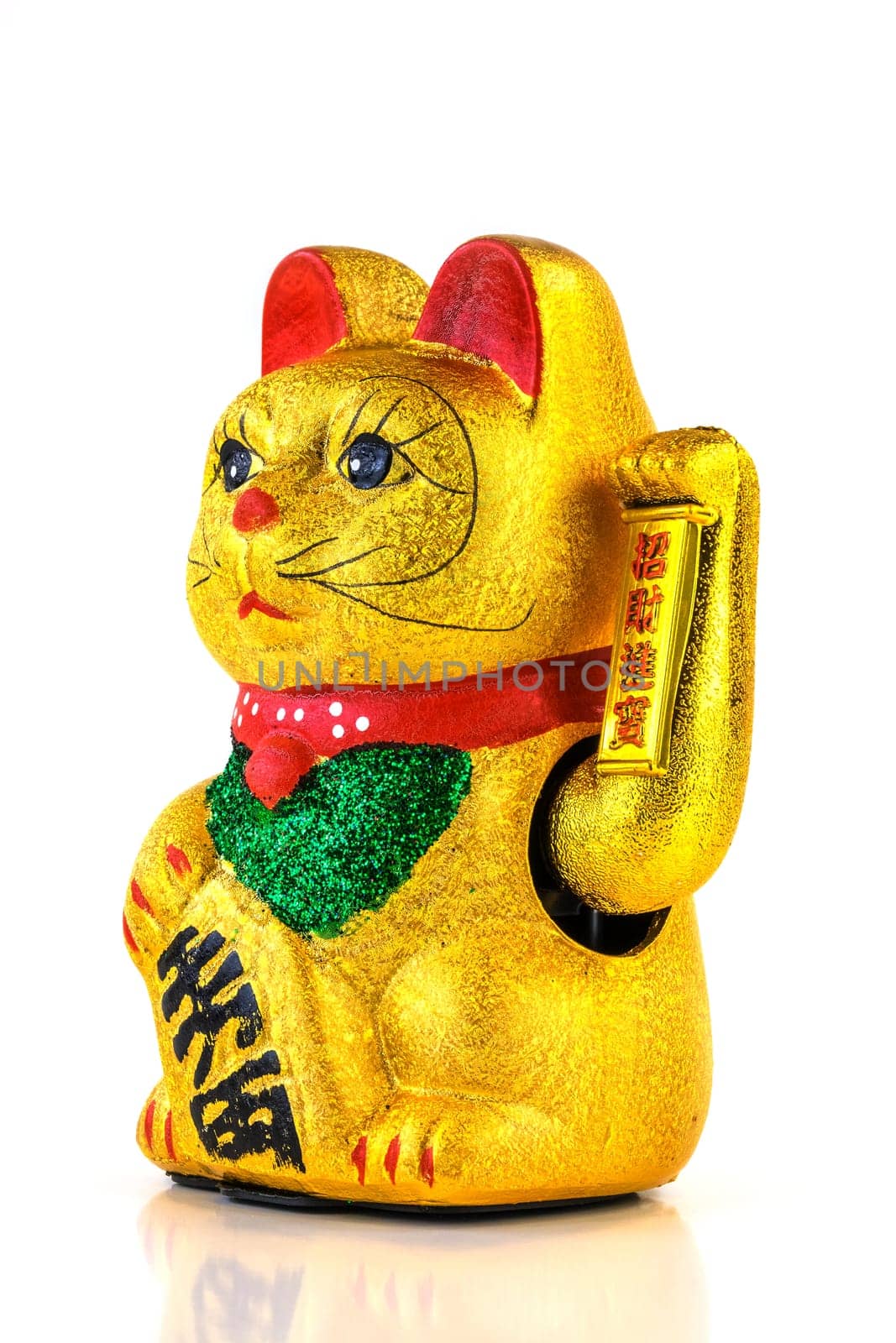 Waving cat,gold-plated welcome cat with waving paw against a white background