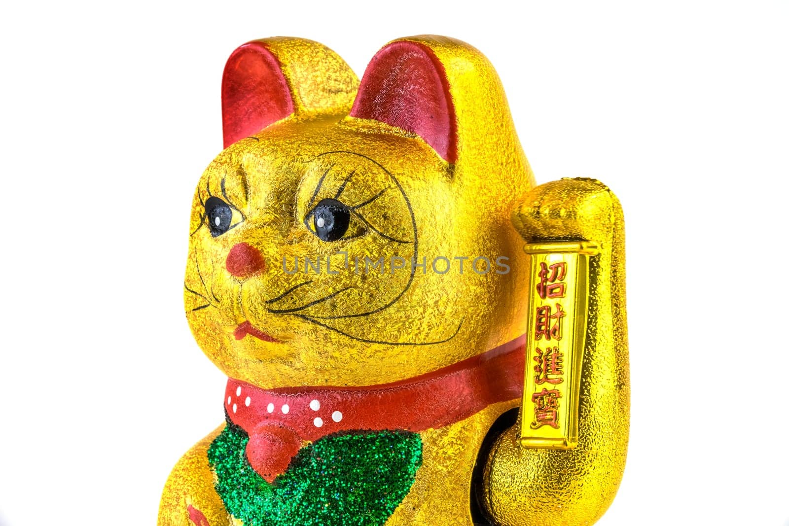 Waving cat,gold-plated welcome cat with waving paw against a white background
