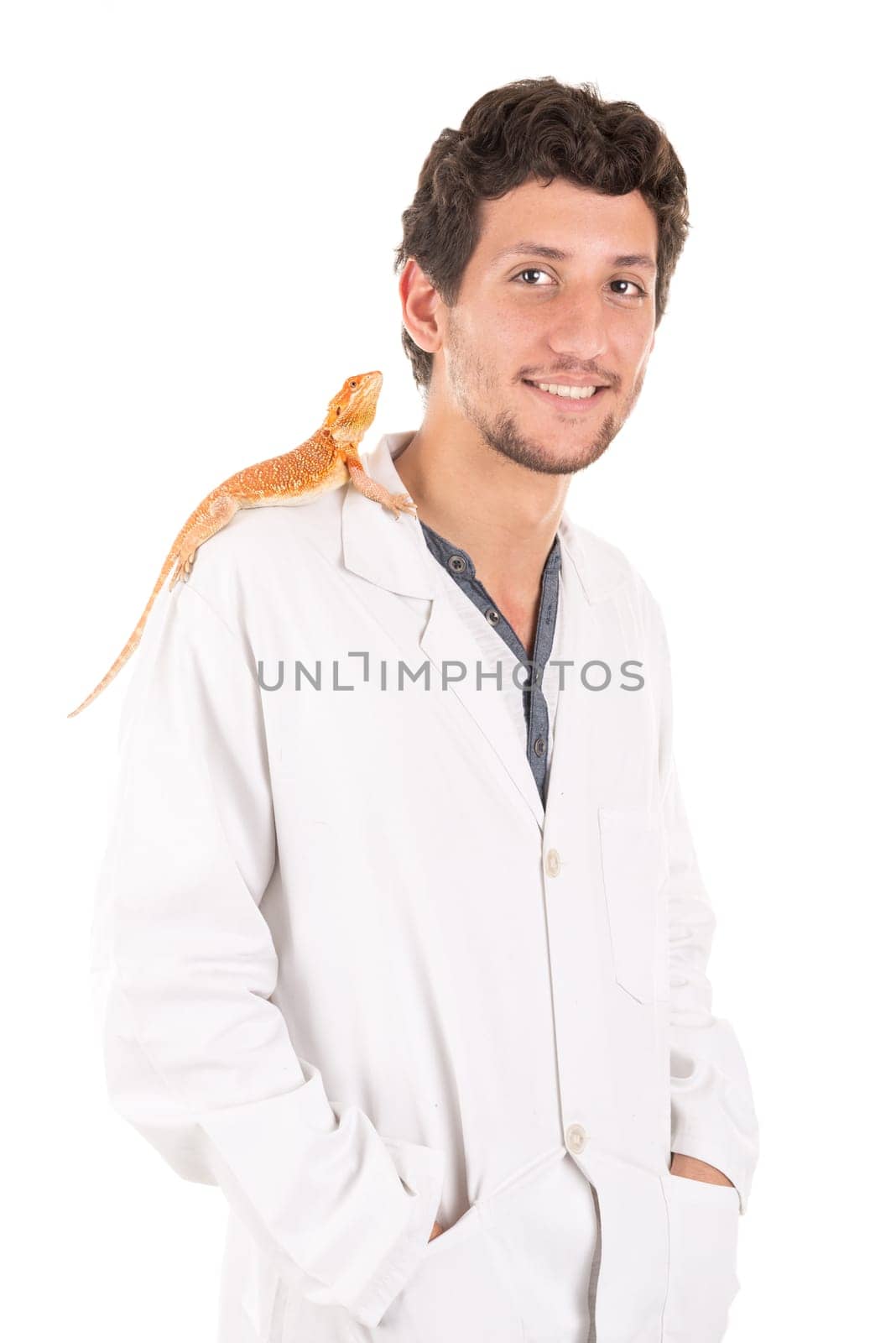 Young veterinarian with lizard isolated in white