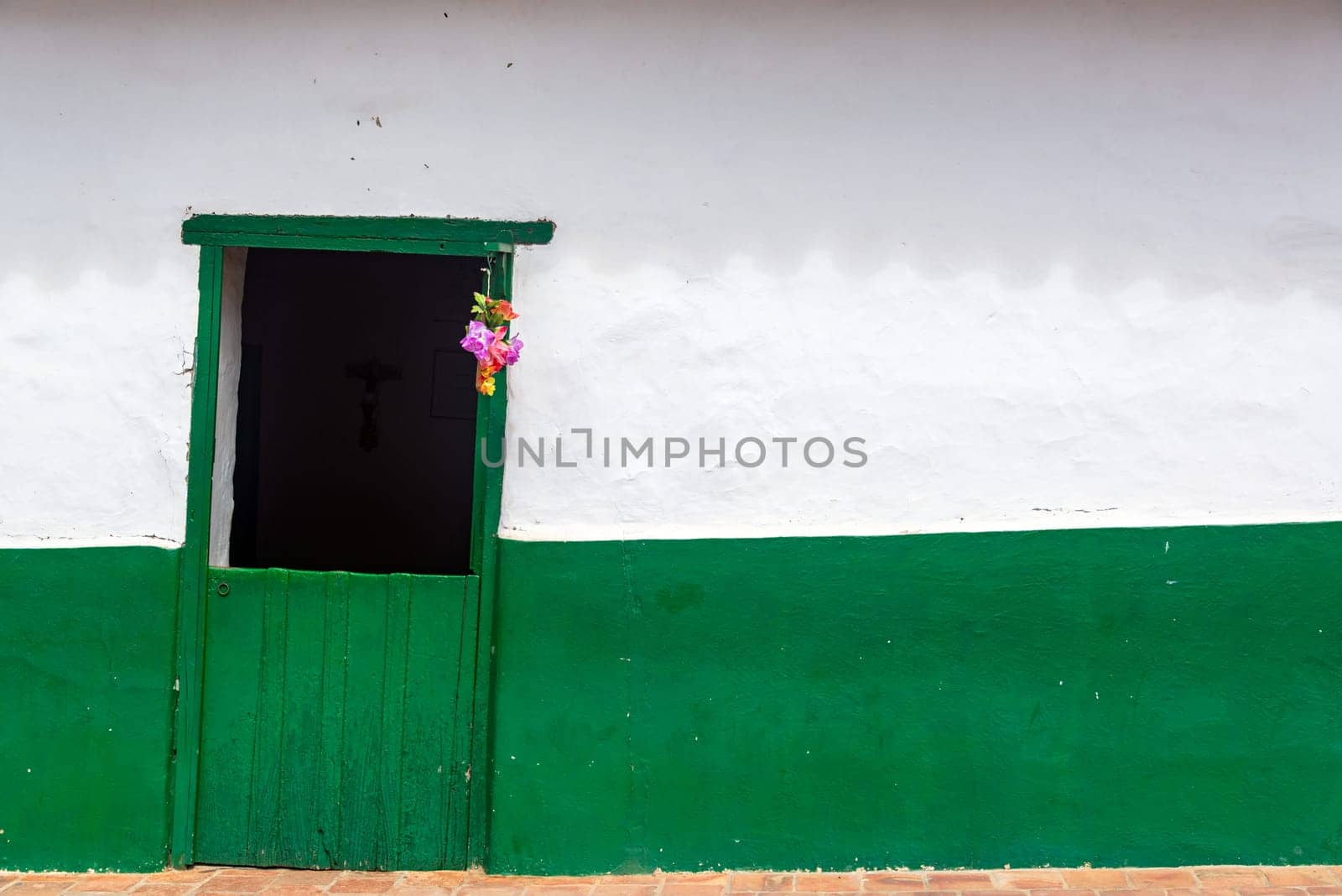 Green and white colonial wall in Barichara, Colombia