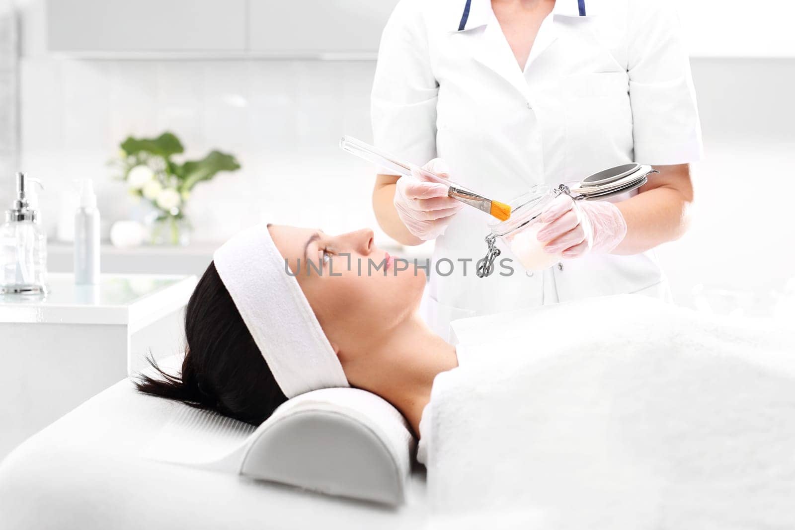 a woman's face during a treatment at a beauty salon\n