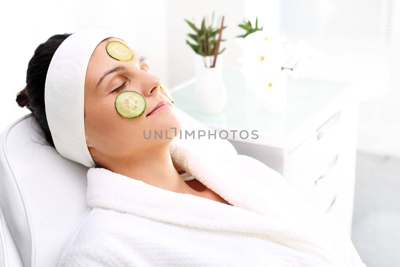 cucumber mask. skin care treatment in the beauty salon\n
