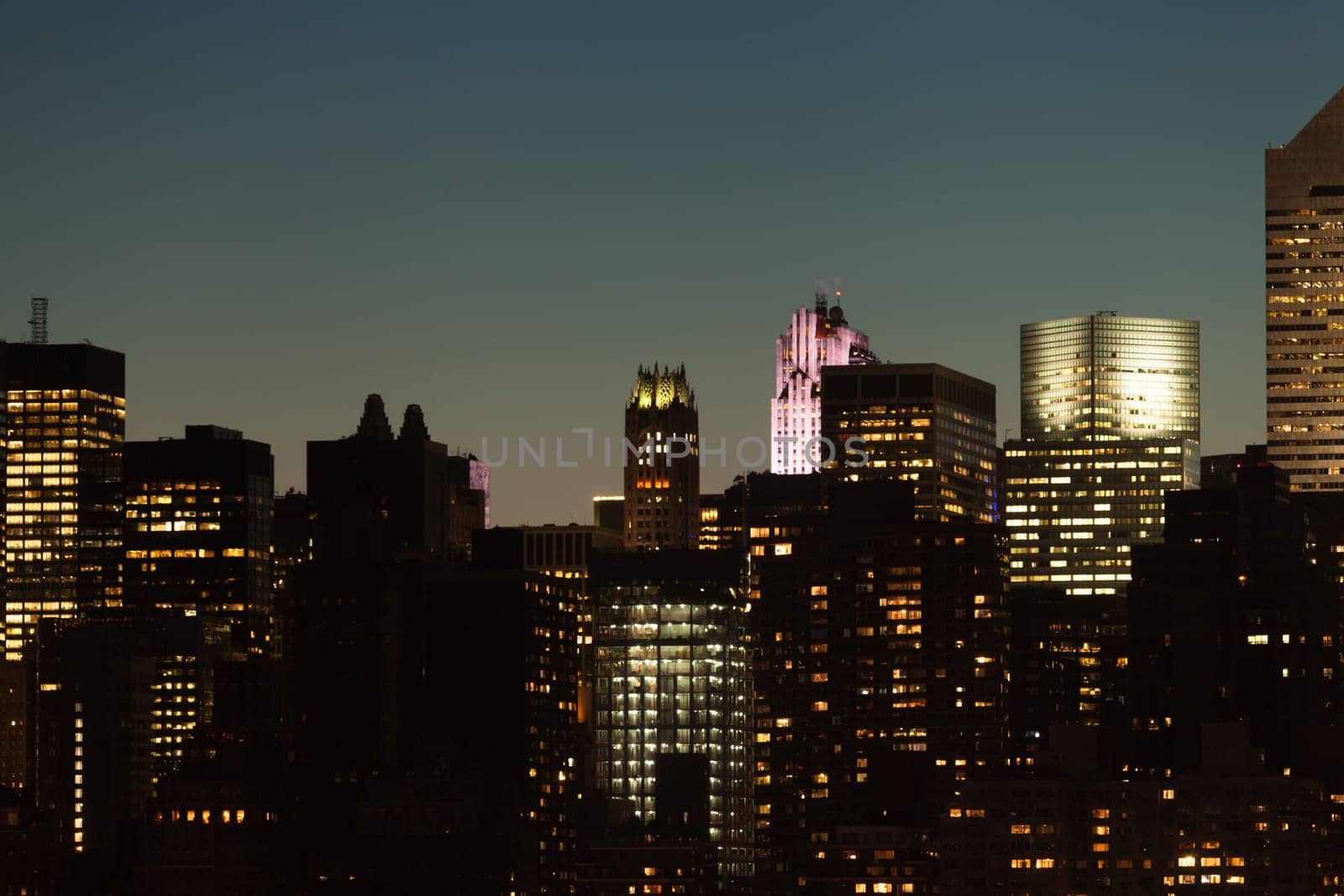 Manhattan skyline detail with skyscrapers during twilight in New York City, USA.