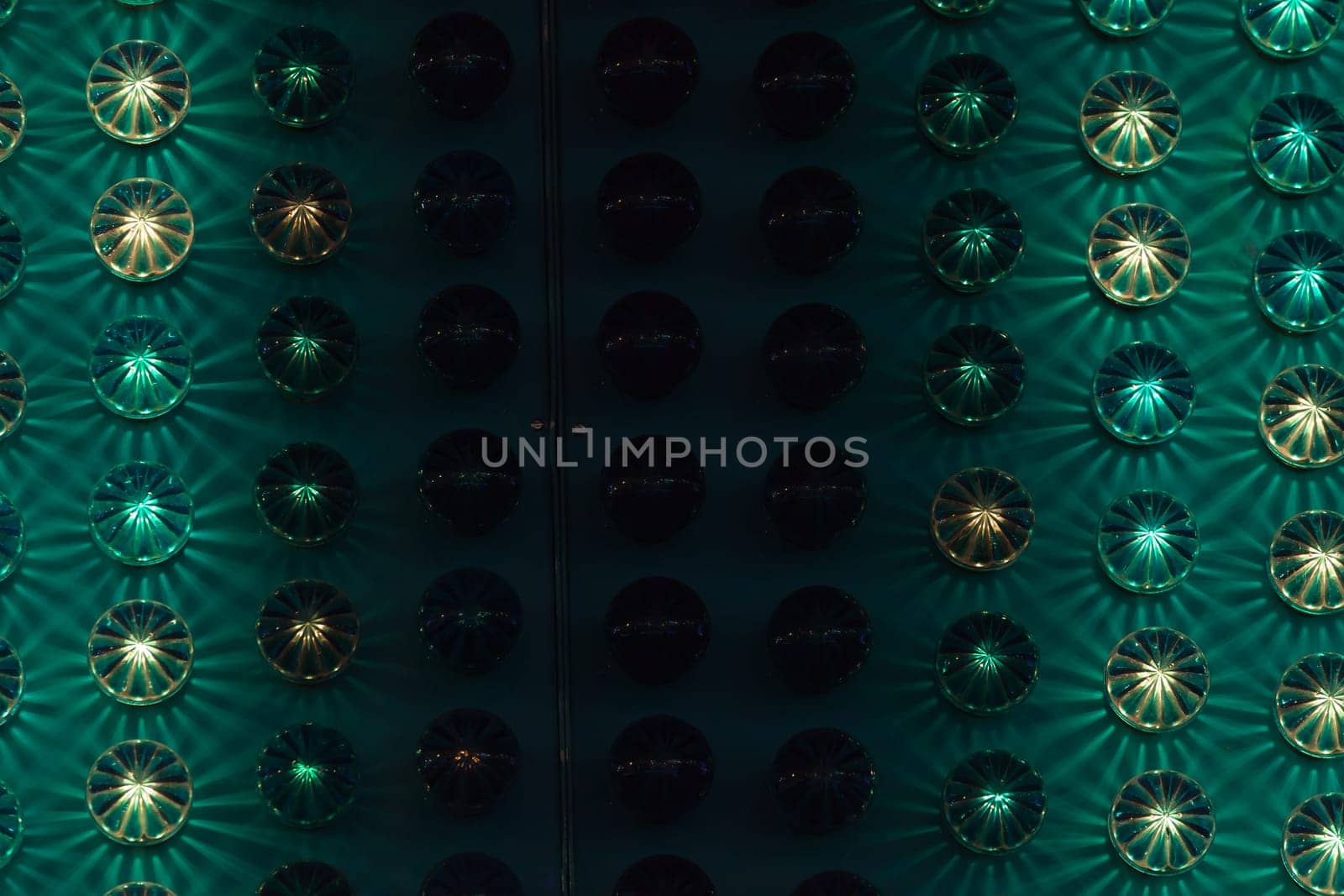 Amusement park background detail with green and yellow lights.