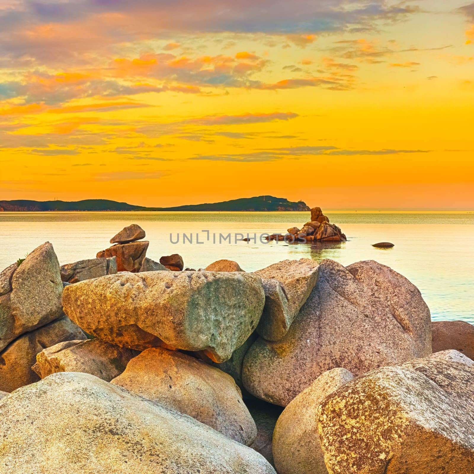 Amazing landscape at sunset. Stones on the foreground.