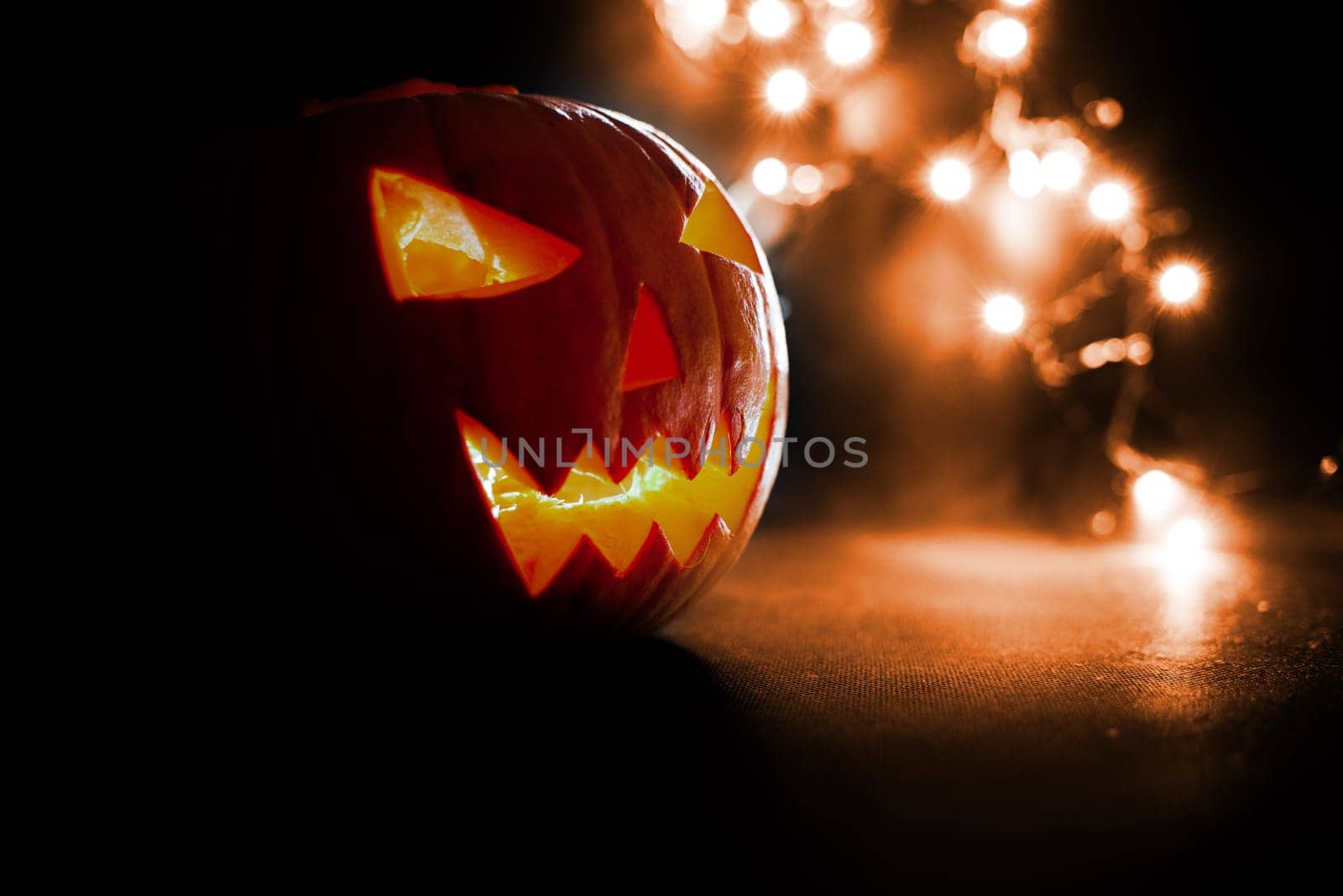 scary halloween pumpkins on a orange light background.