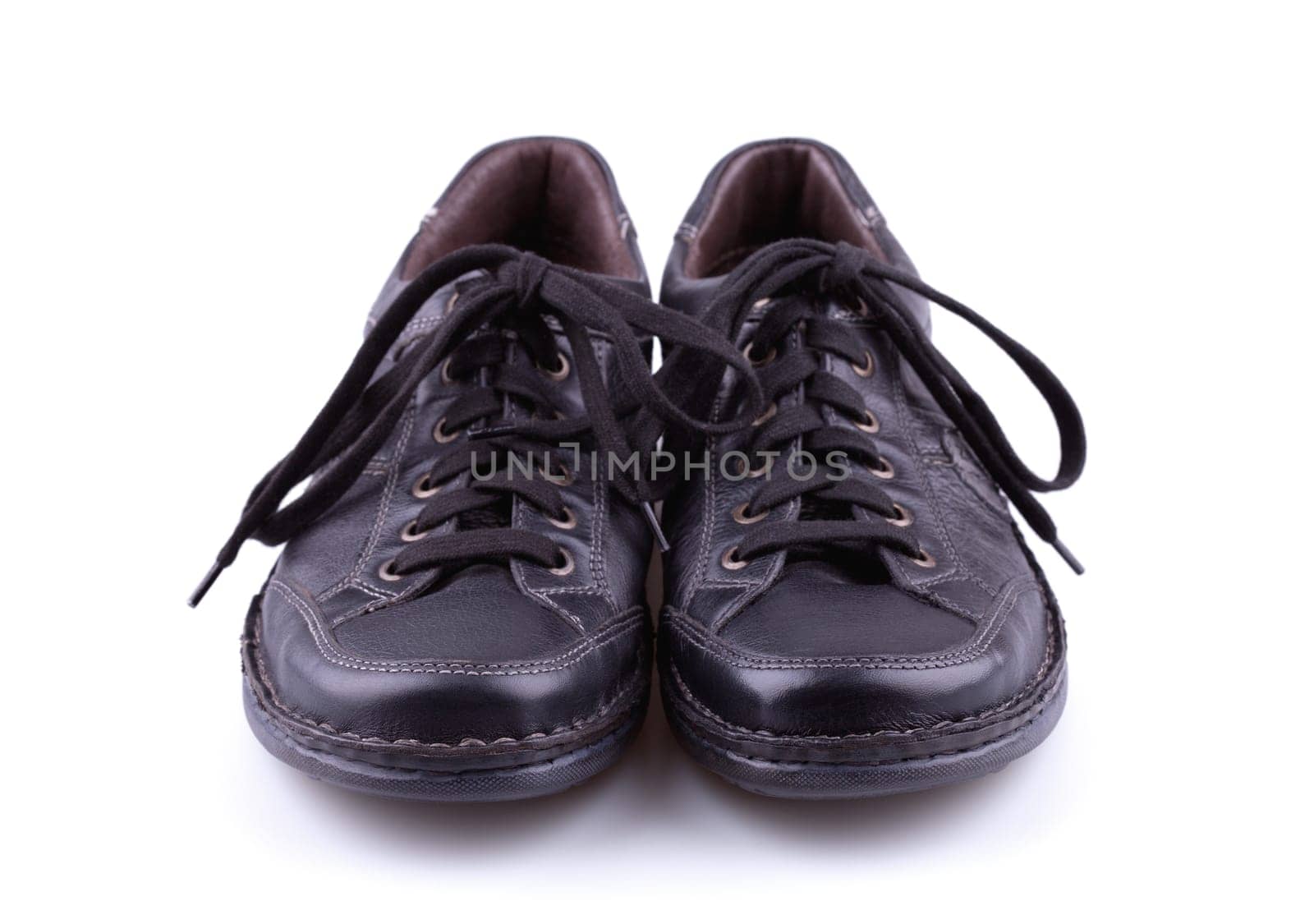 Black leather men's shoes on white background.