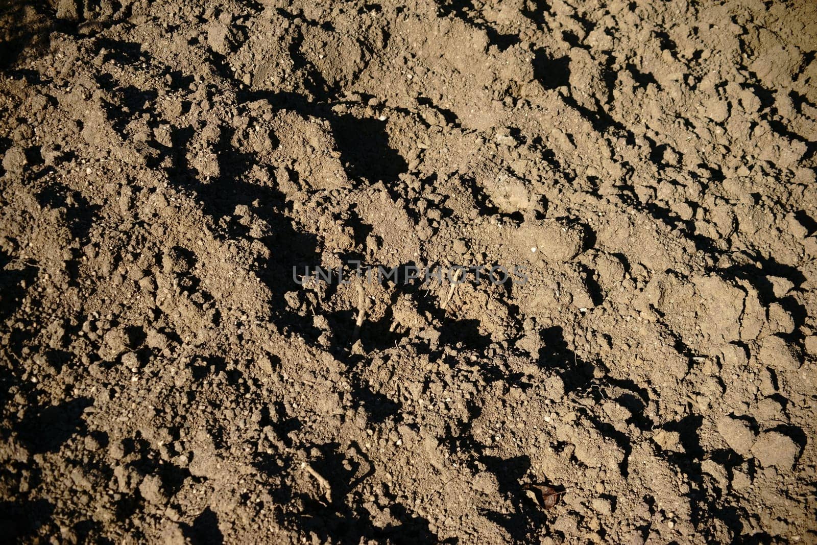 The close-up of dug and loosened soil.