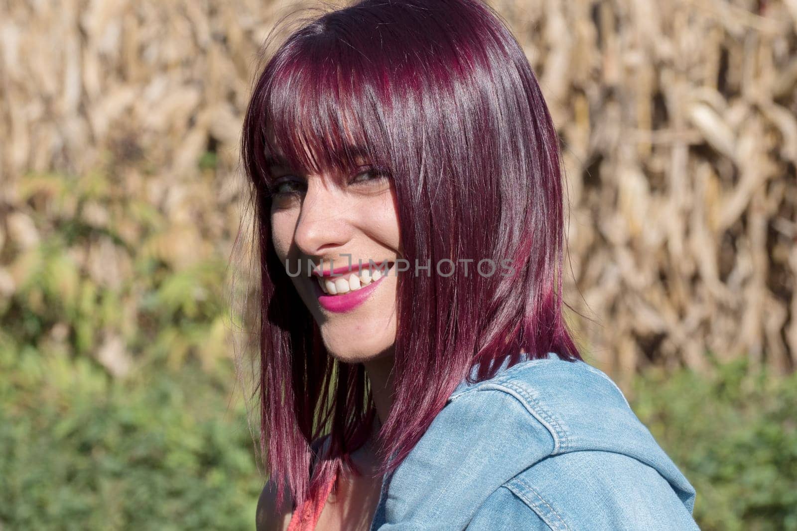 portrait of beautiful young woman with red hair, outdoors