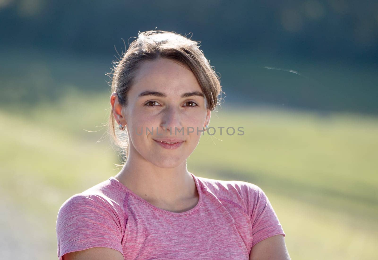 portrait of a young sporty woman in the countryside