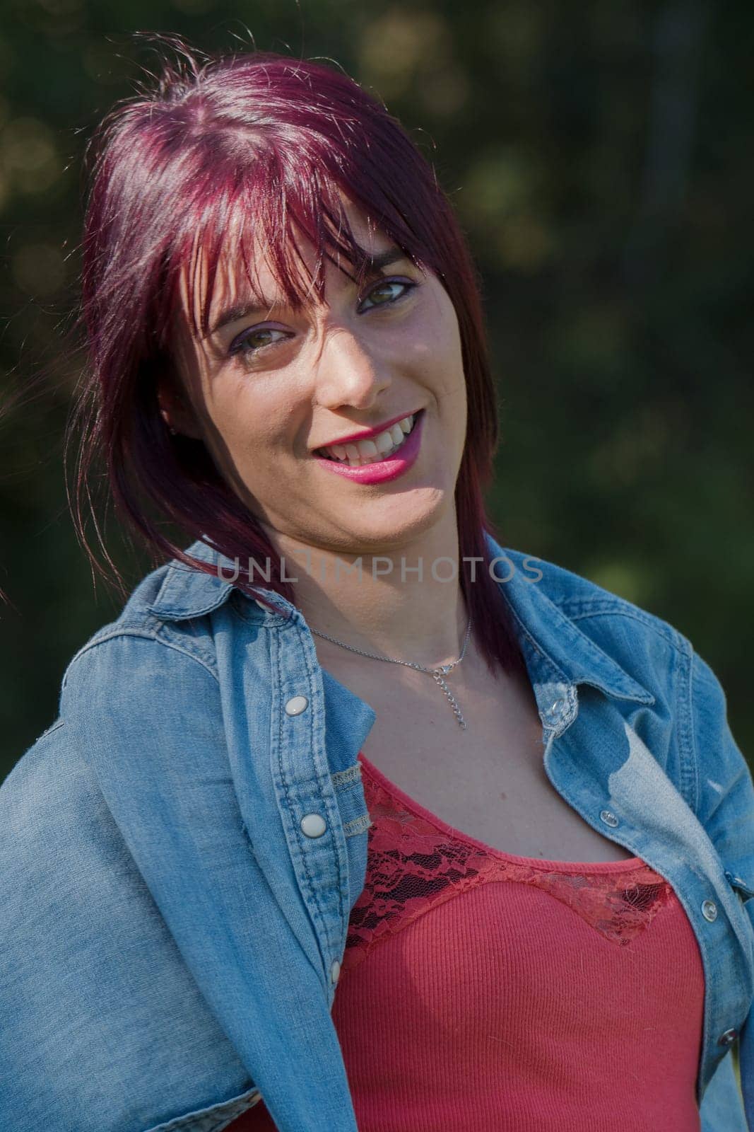 portrait of beautiful young woman with red hair, outdoors