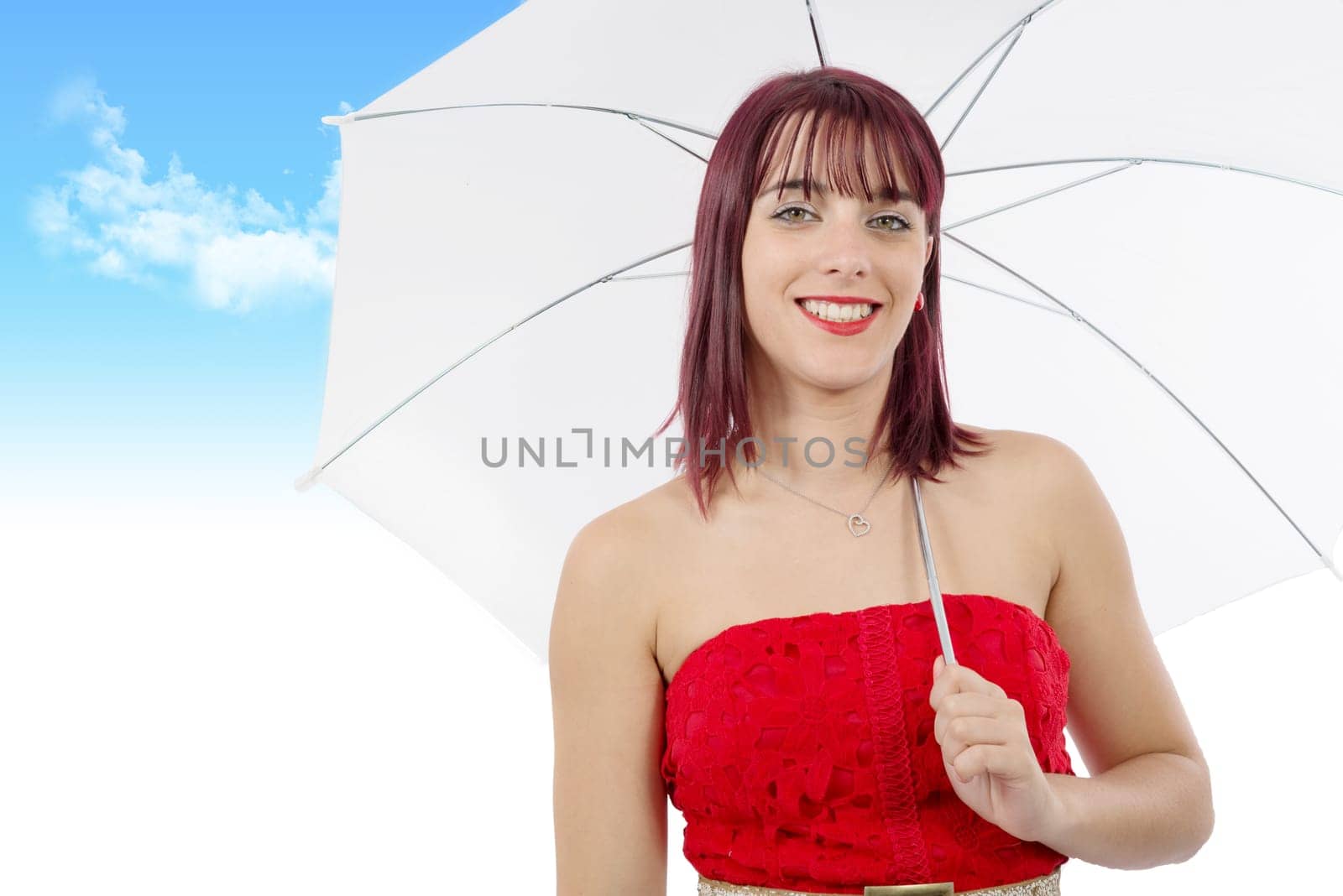 beautiful young woman with an umbrella on blue sky with clouds
