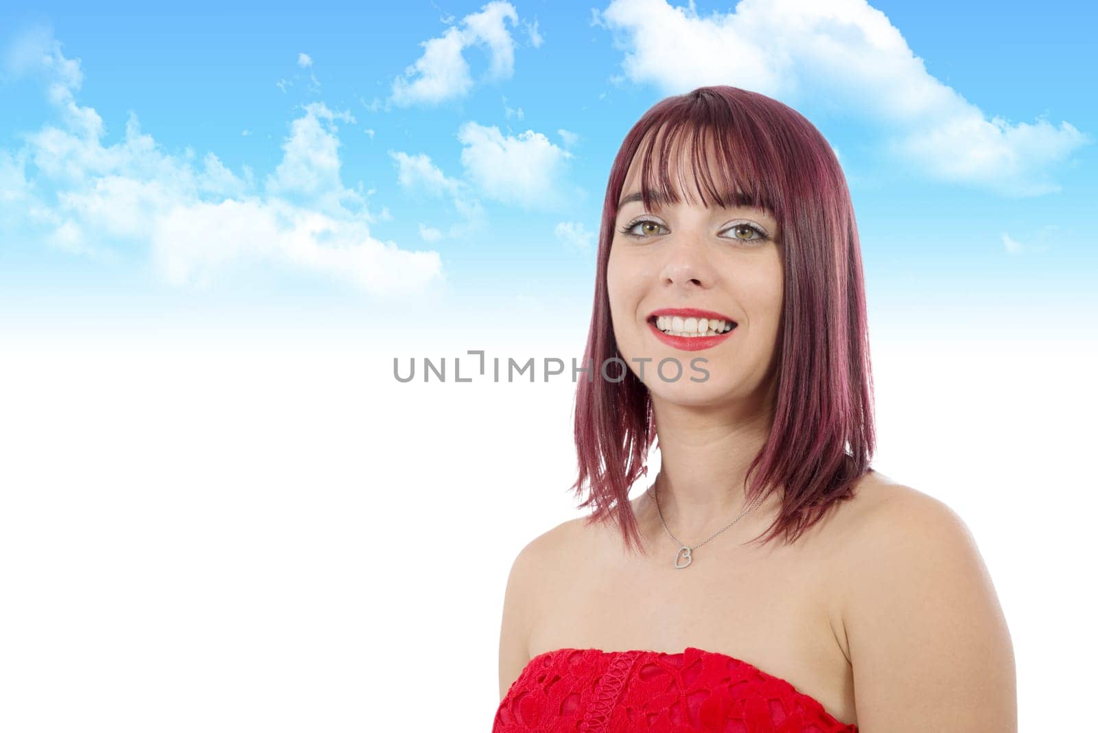 portrait of a beautiful young woman with green eyes in blue sky