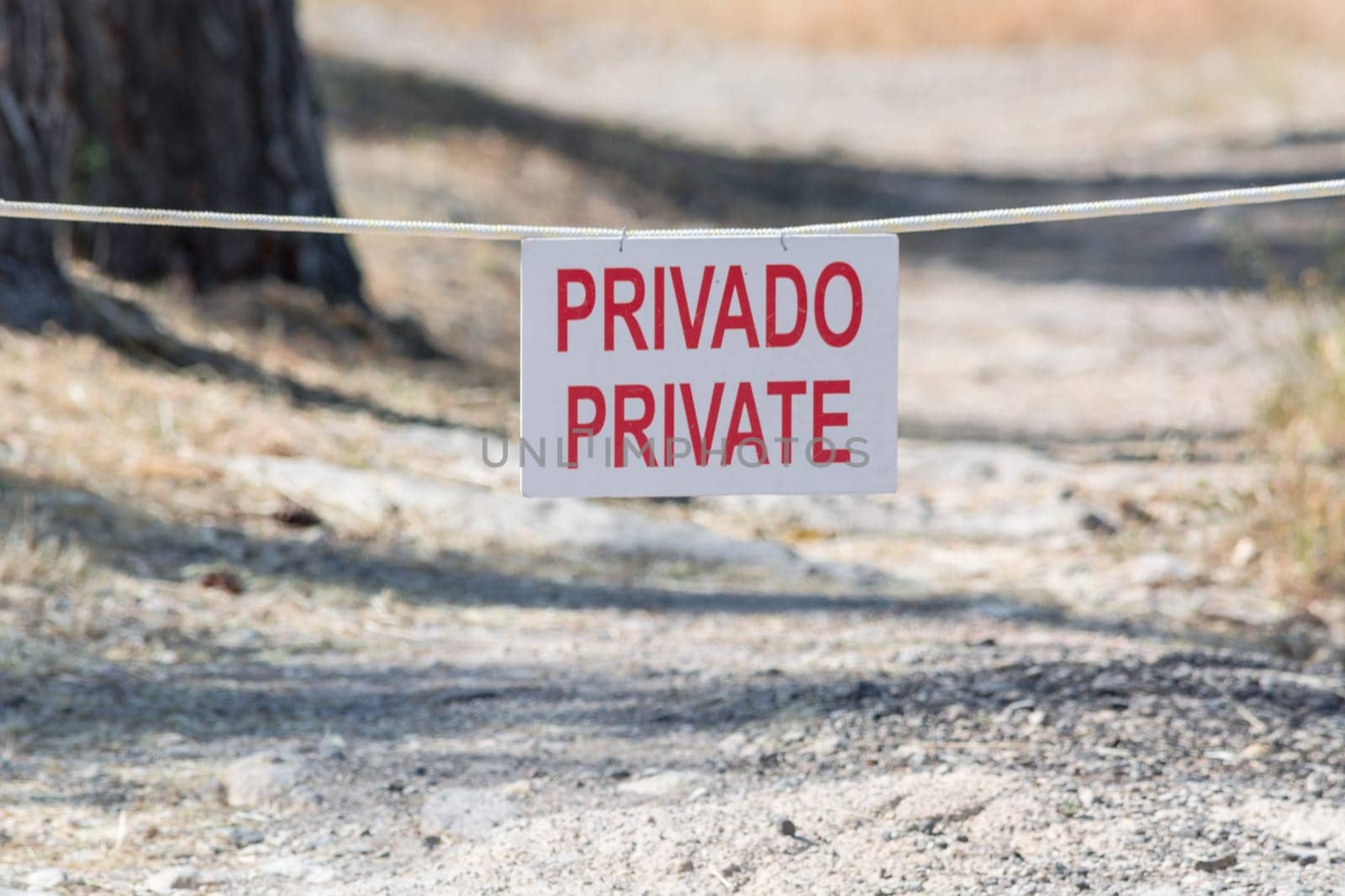 White plaque with inscription in Spanish "Privado and Private"".."