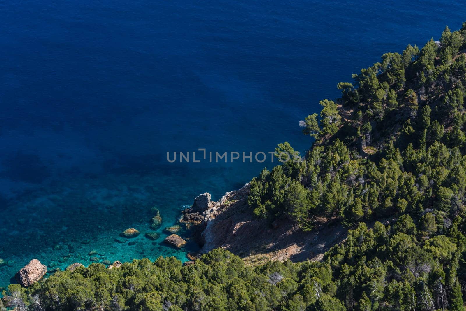 Sea waves and rocks on the steep west coast of Mallorca. .