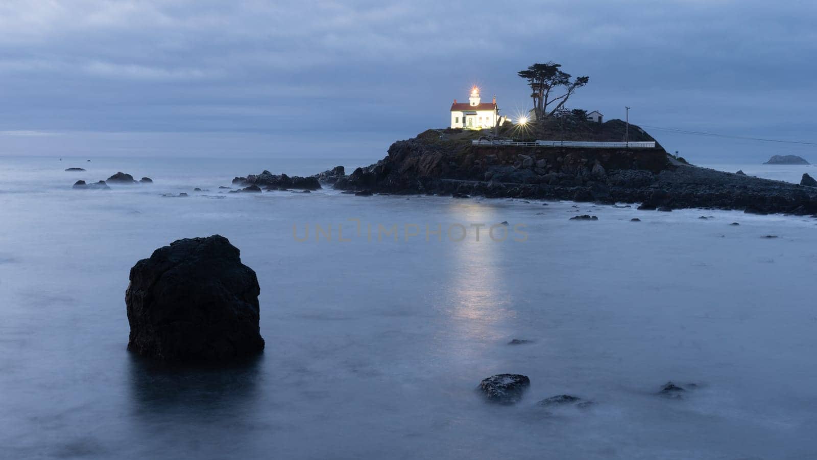 Night falls on a rocky outcropping in Crescent City