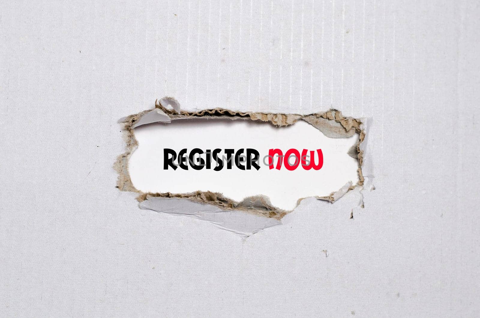 The word register now appearing behind torn paper