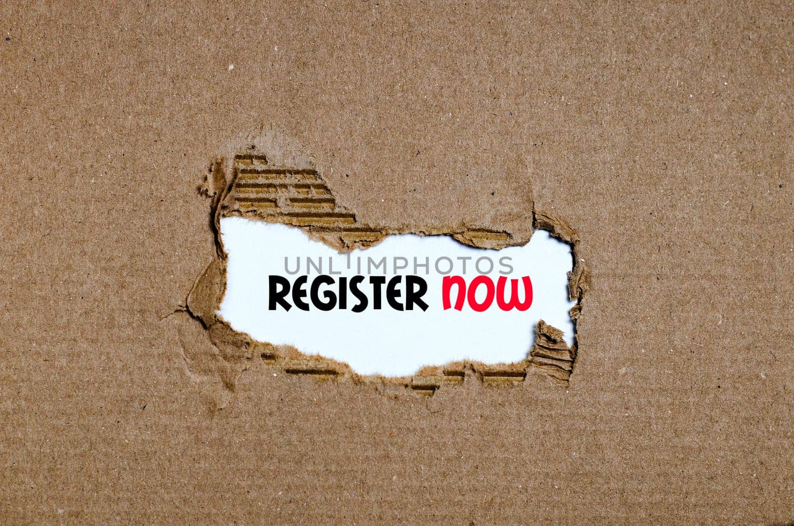 The word register now appearing behind torn paper