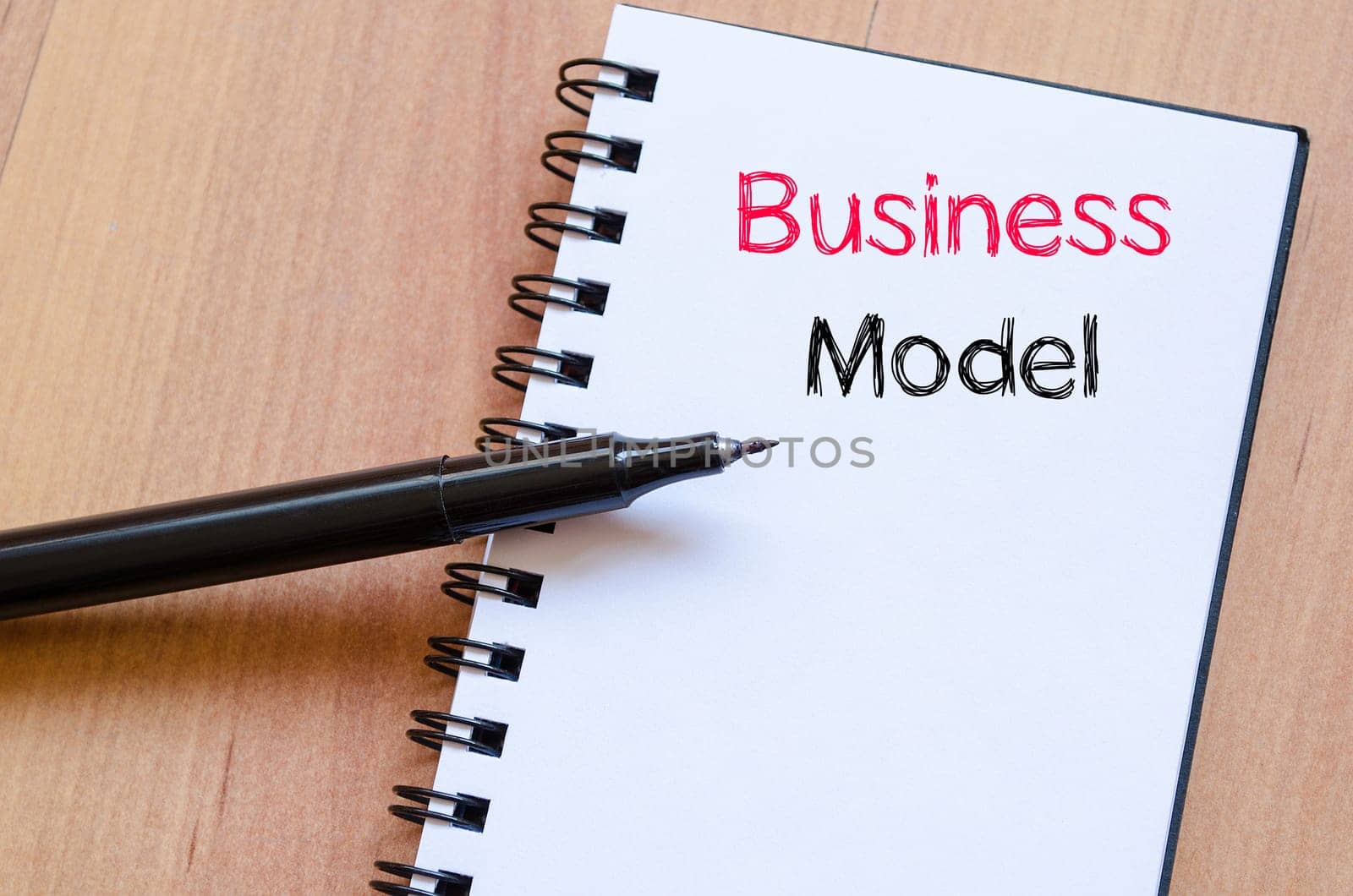 Business model text concept write on notebook