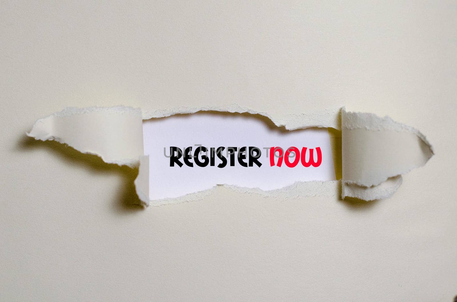 The word register now appearing behind torn paper