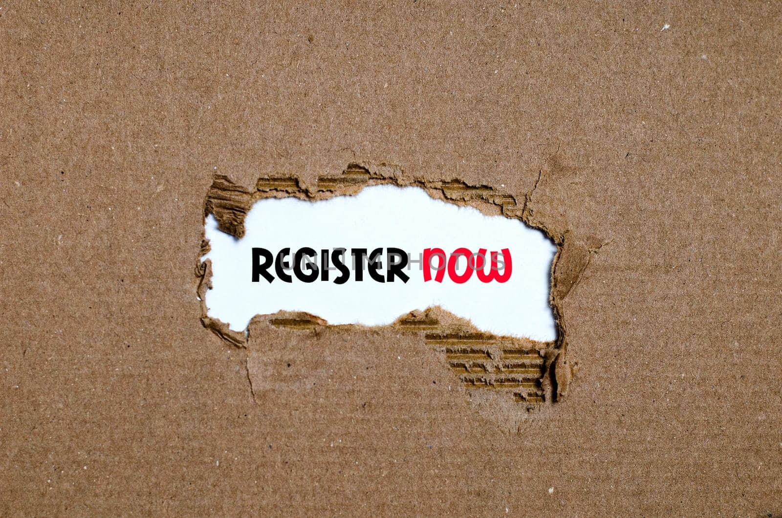 The word register now appearing behind torn paper