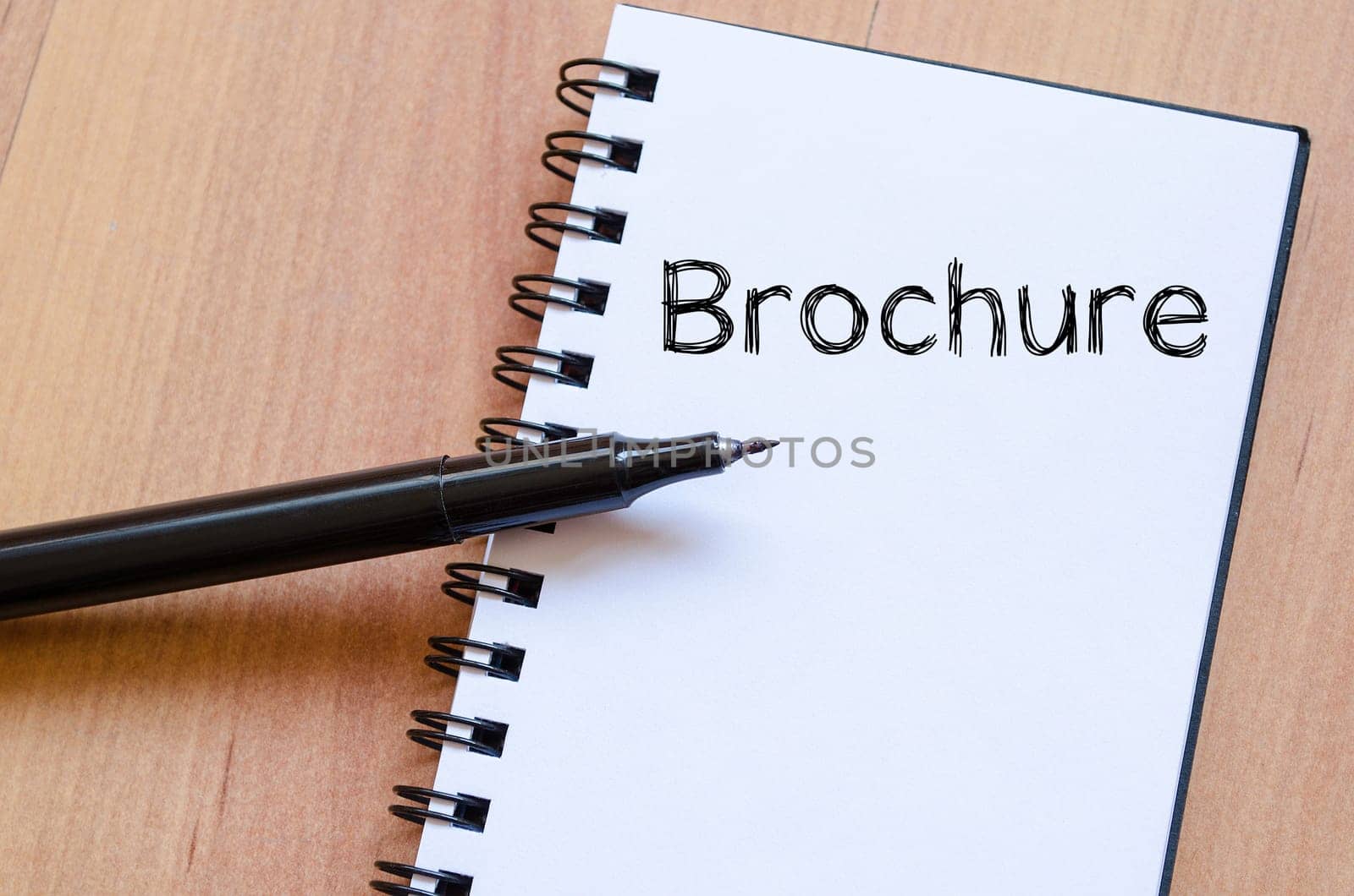 Brochure text concept write on notebook