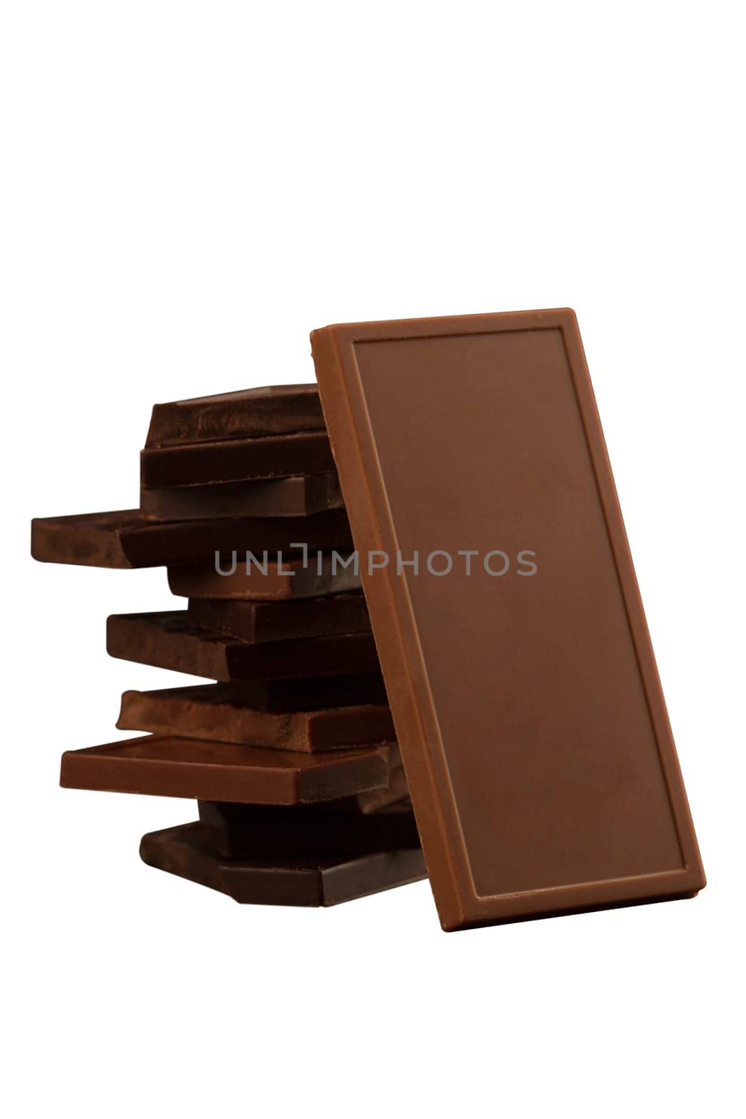 Front view of square shaped chocolate pieces isolated on white background
