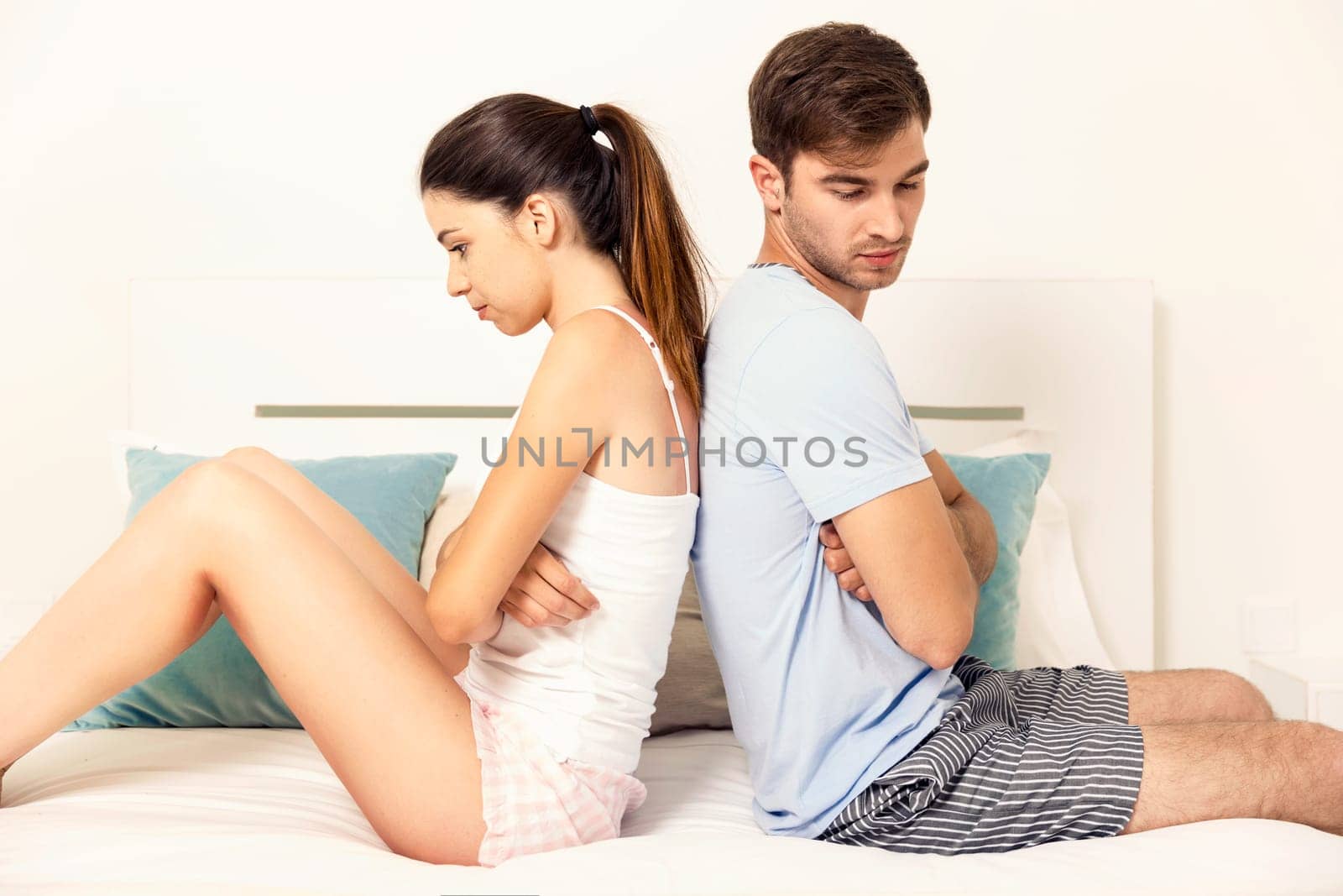 Young couple dating on a hotel bedroom