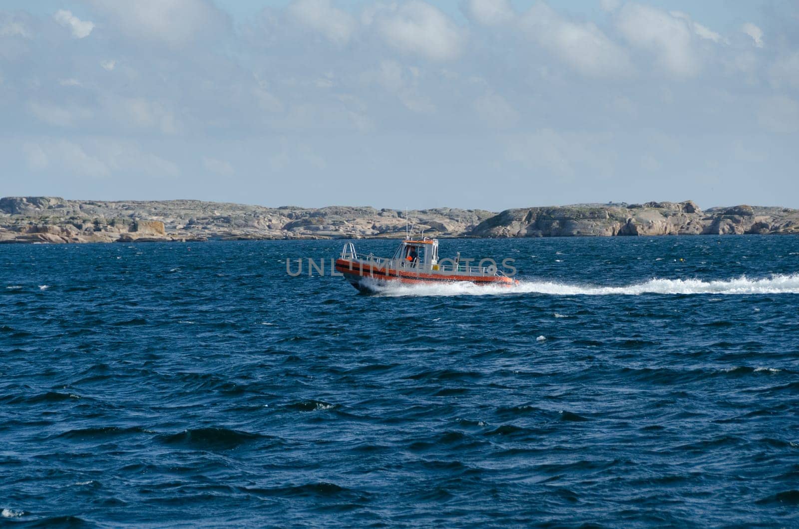 one little fast fishingboat on sweden westcoast on the way to the harbour