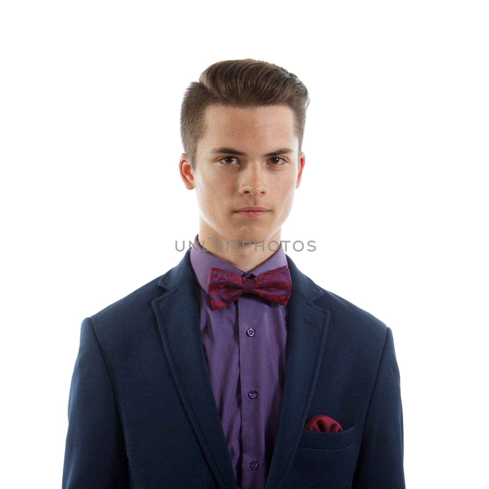 An elegant teenage boy wearing a suit