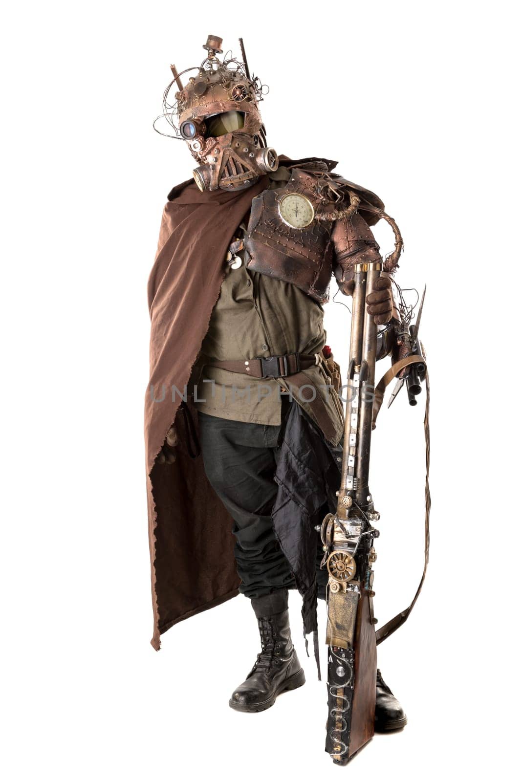 Futuristic soldier posing with gun and armor isolated in white
