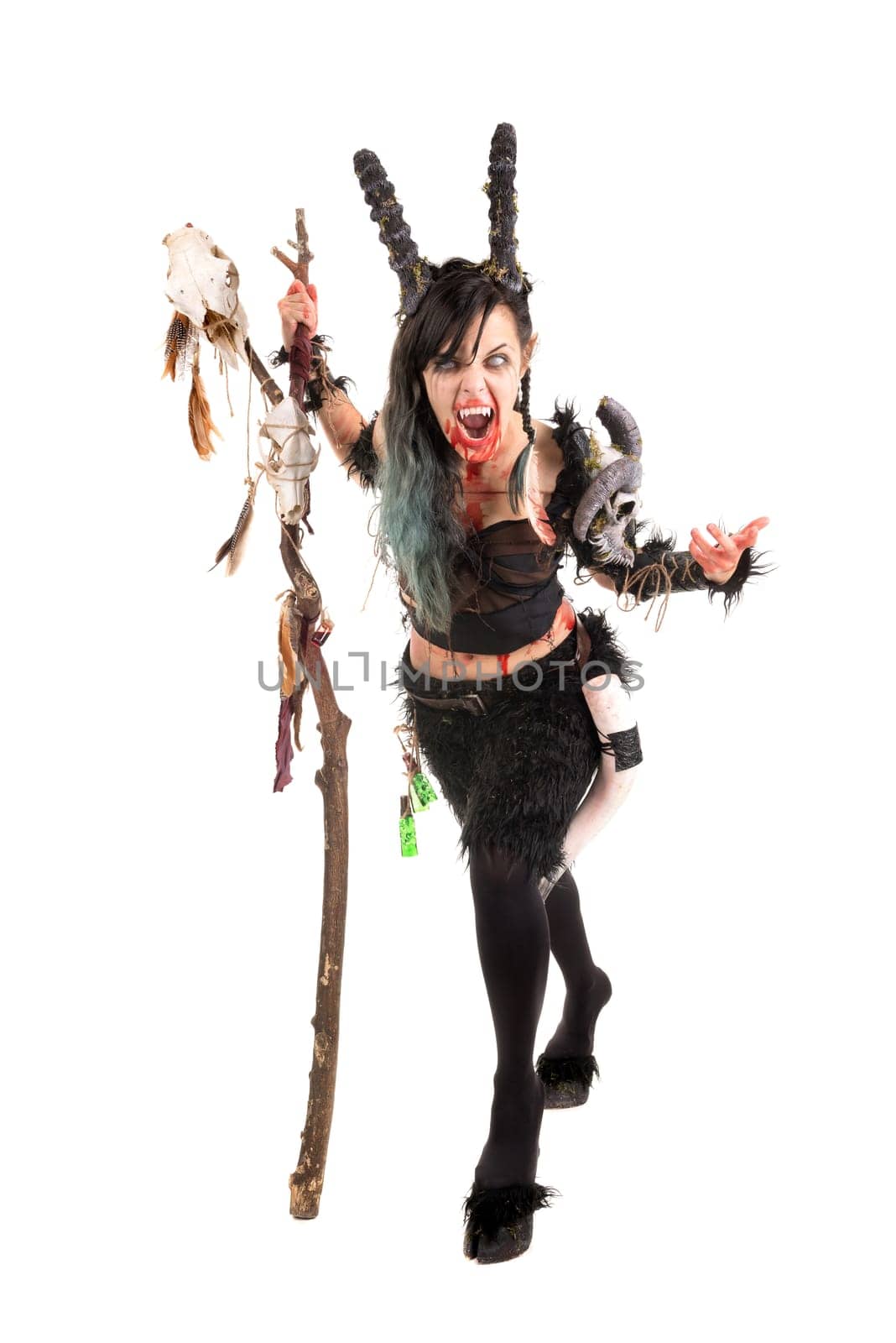 Faun sorceress with big horns and blood isolated in white
